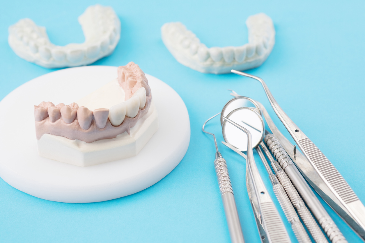 dentist tools and prosthodontic model.