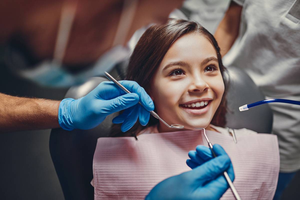child in dentists chair