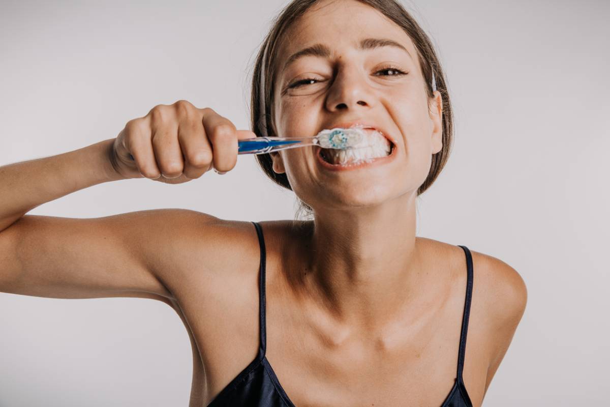 woman brushing teeth