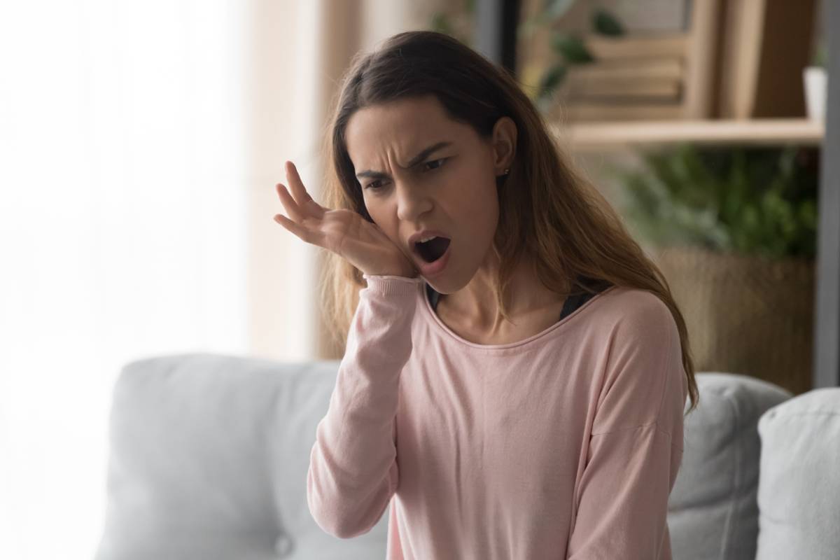 Woman with cavities under fillings