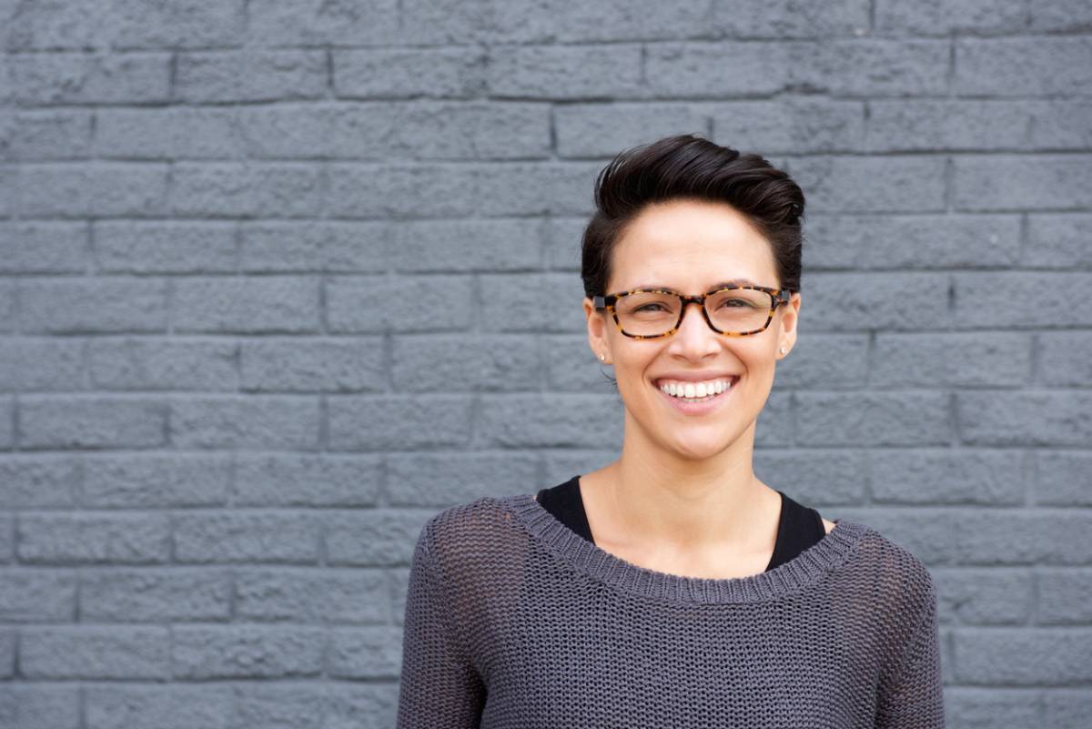 Woman smiling enjoying results of teeth whitening