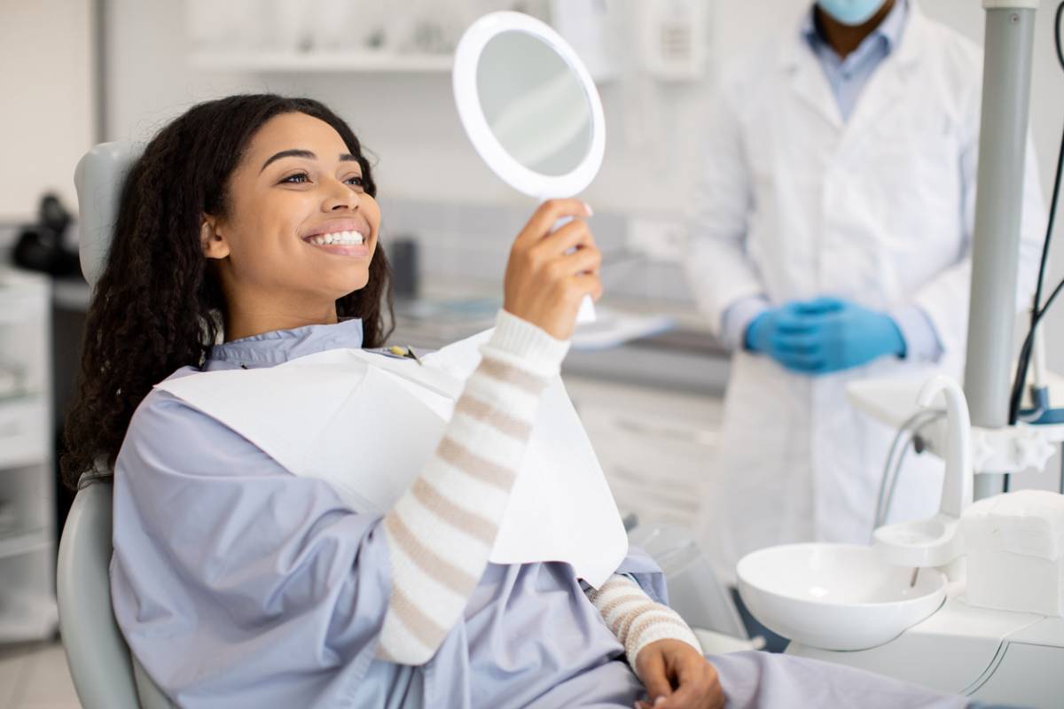 concept of smiling woman with benefits of dental bonding